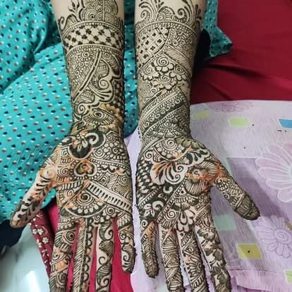 Intricate full-arm bridal mehndi